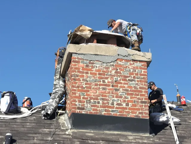 Daytona Beach Chimney Sweep installing a custom chimney crown in Daytona Beach, FL
