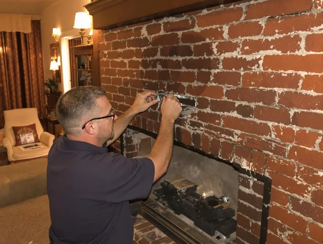 Daytona Beach Chimney Sweep expert fixing a fireplace in Daytona Beach, FL